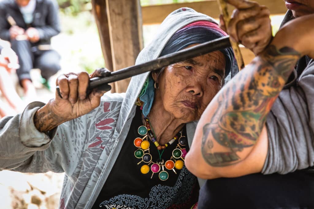 Hand Tapping tribal tattoo