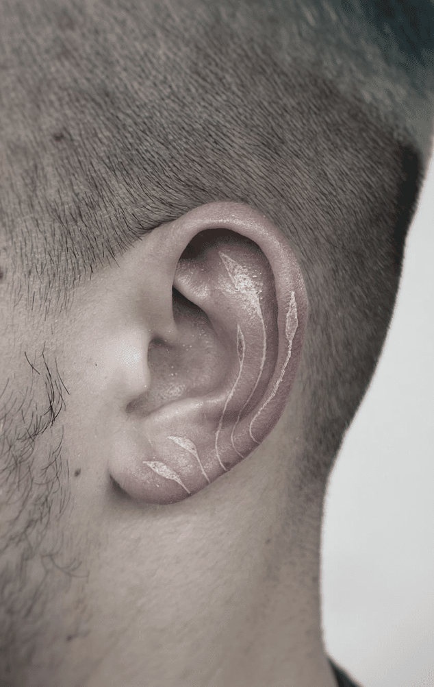 Ear With White Ink Tattoo