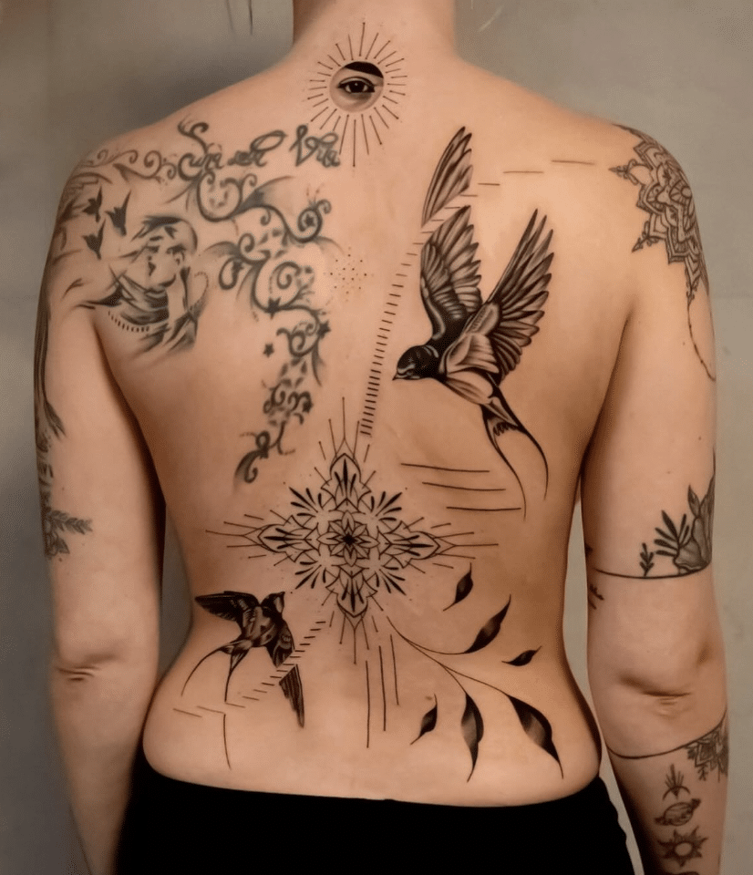 Swallow On Back Tattoo